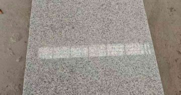 铁岭芝麻白光面毛板